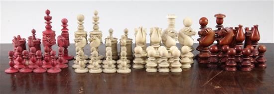 A late Victorian carved and stained ivory chess set, kings 3.75in.